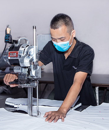 Cutting fabric with electric scissors